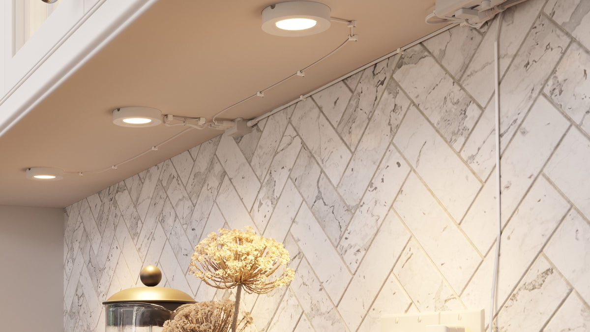 INLIGHT LED puck lights under a white kitchen cabinet