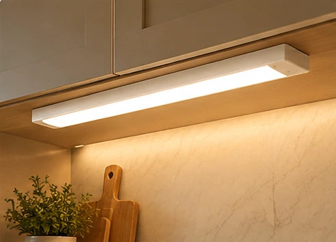 Illustrative under-cabinet lighting scene from the approved category design; not a photograph of a specific product installation.